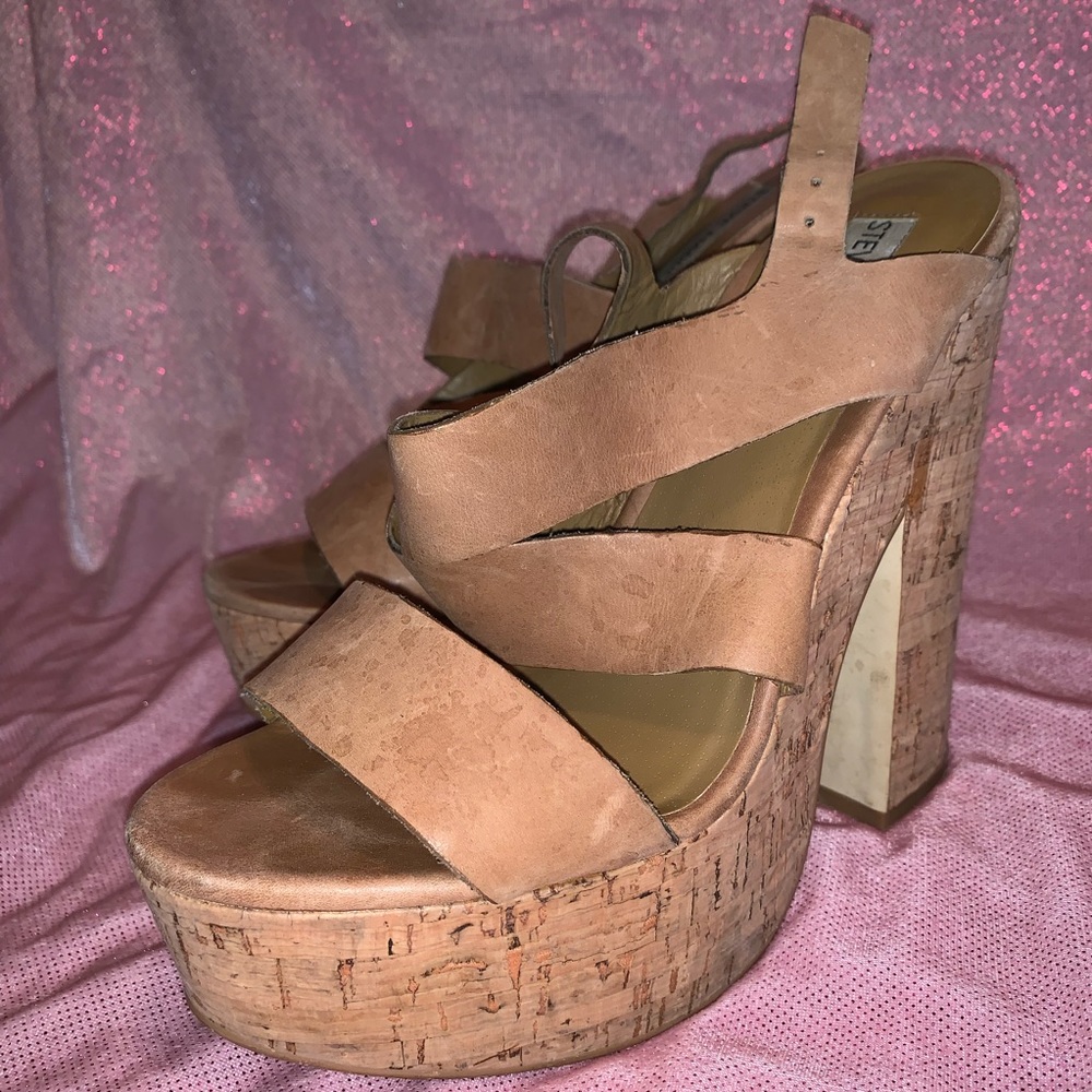 Tan wedge platform sandals.